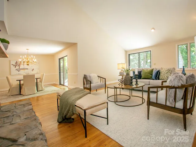 a living room with furniture and a table