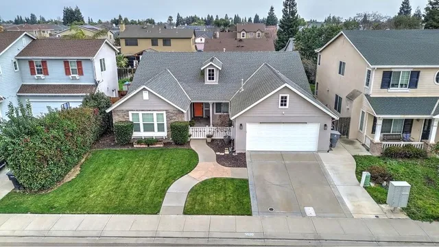 a aerial view of a house with a yard