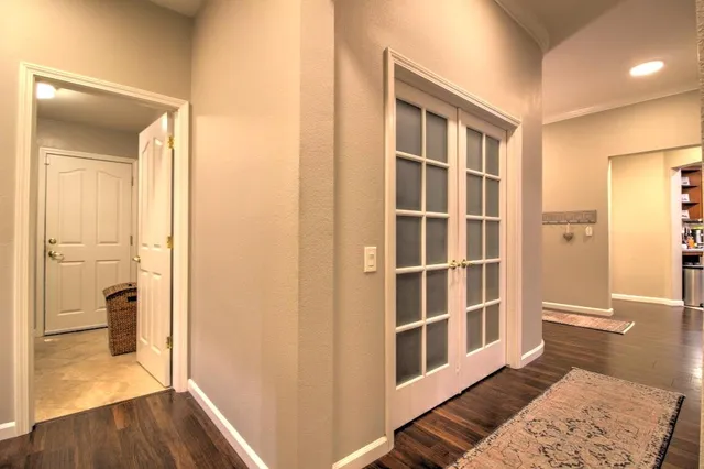a bathroom with a double vanity sink toilet mirror and bathtub