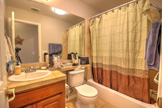 an aerial view of residential houses with city view