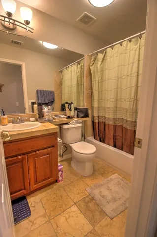 an aerial view of a house with outdoor space