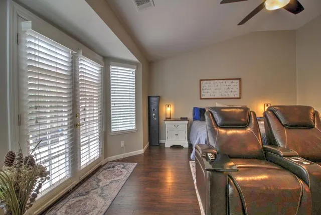 a outdoor living space with furniture and a black umbrella