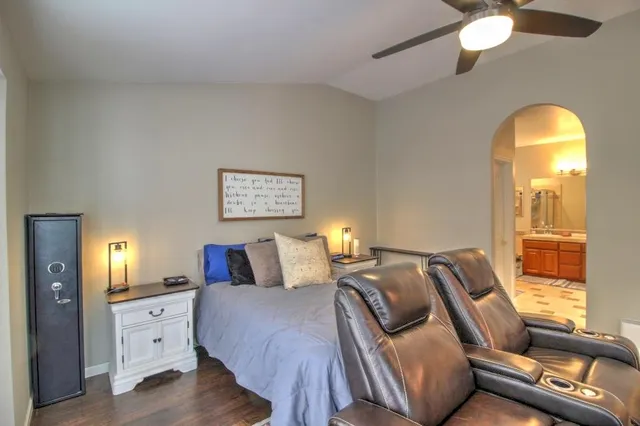 a view of a patio with chairs and plants