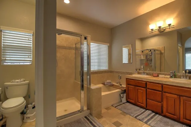 a view of a patio with table and chairs