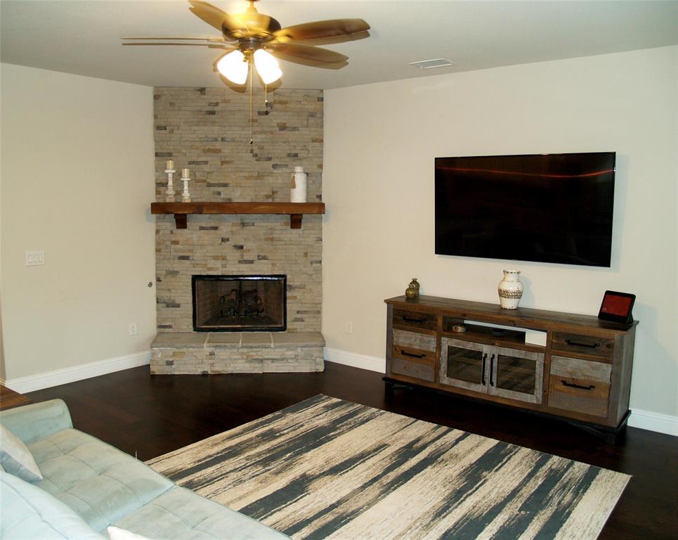2104 Vista Ridge Road Melissa, TX 75454 - Photo 16 of 40 a bedroom with a bed and a flat screen tv