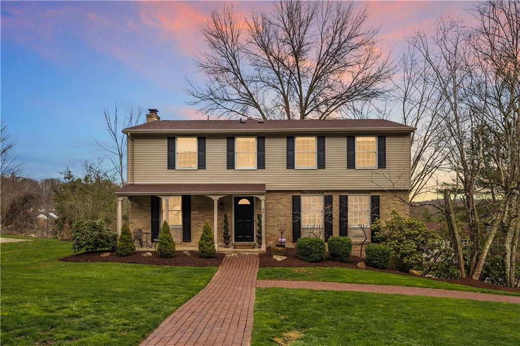 front view of a house with a yard
