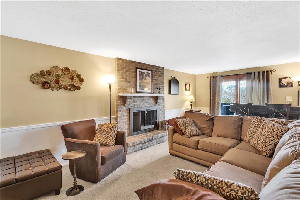 111 Hidden Valley Road Monroeville, PA 15146 - Photo 12 of 25 a living room with furniture and a fireplace
