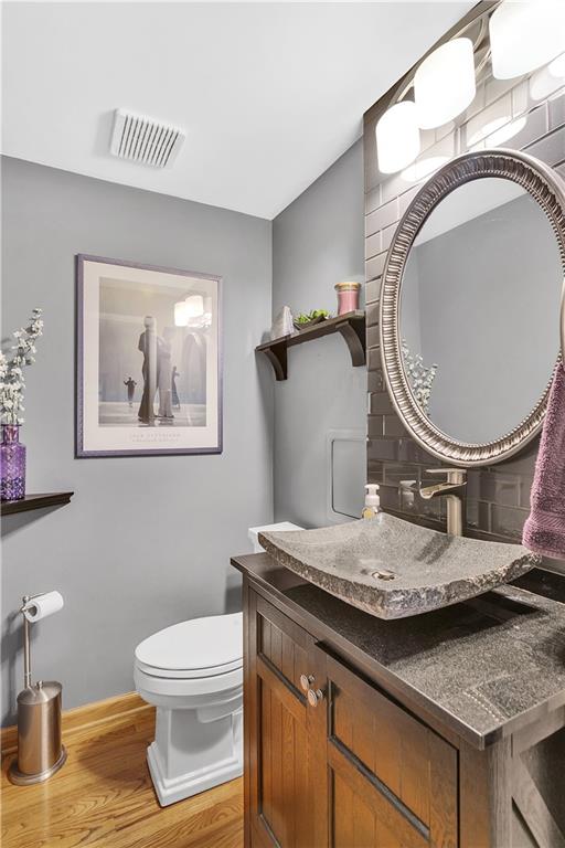 111 Hidden Valley Road Monroeville, PA 15146 - Photo 4 of 25 a bathroom with a sink a toilet and a mirror
