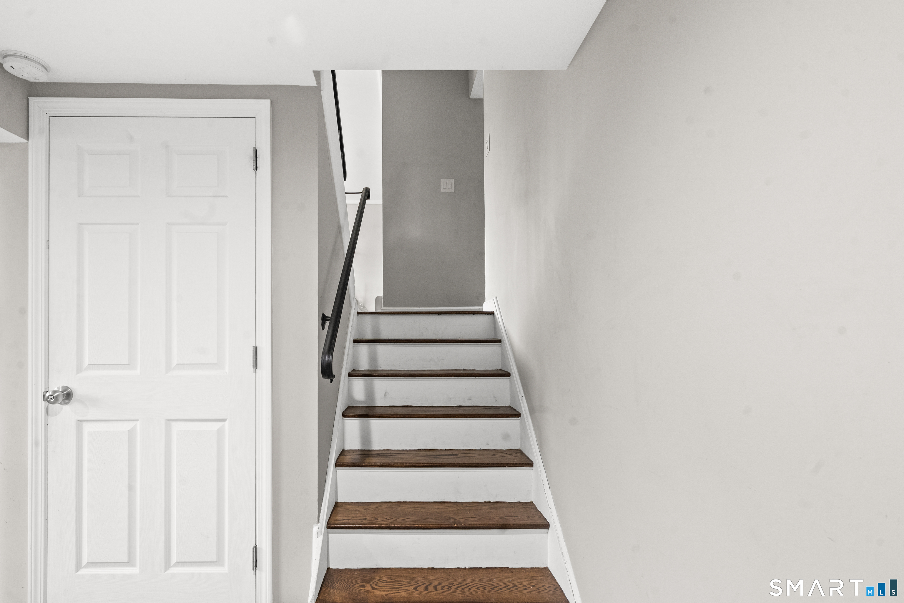 41 Pine Tree Ridge Meriden, CT 06450 - Photo 14 of 16 stairs leading to lower level and door to basement
