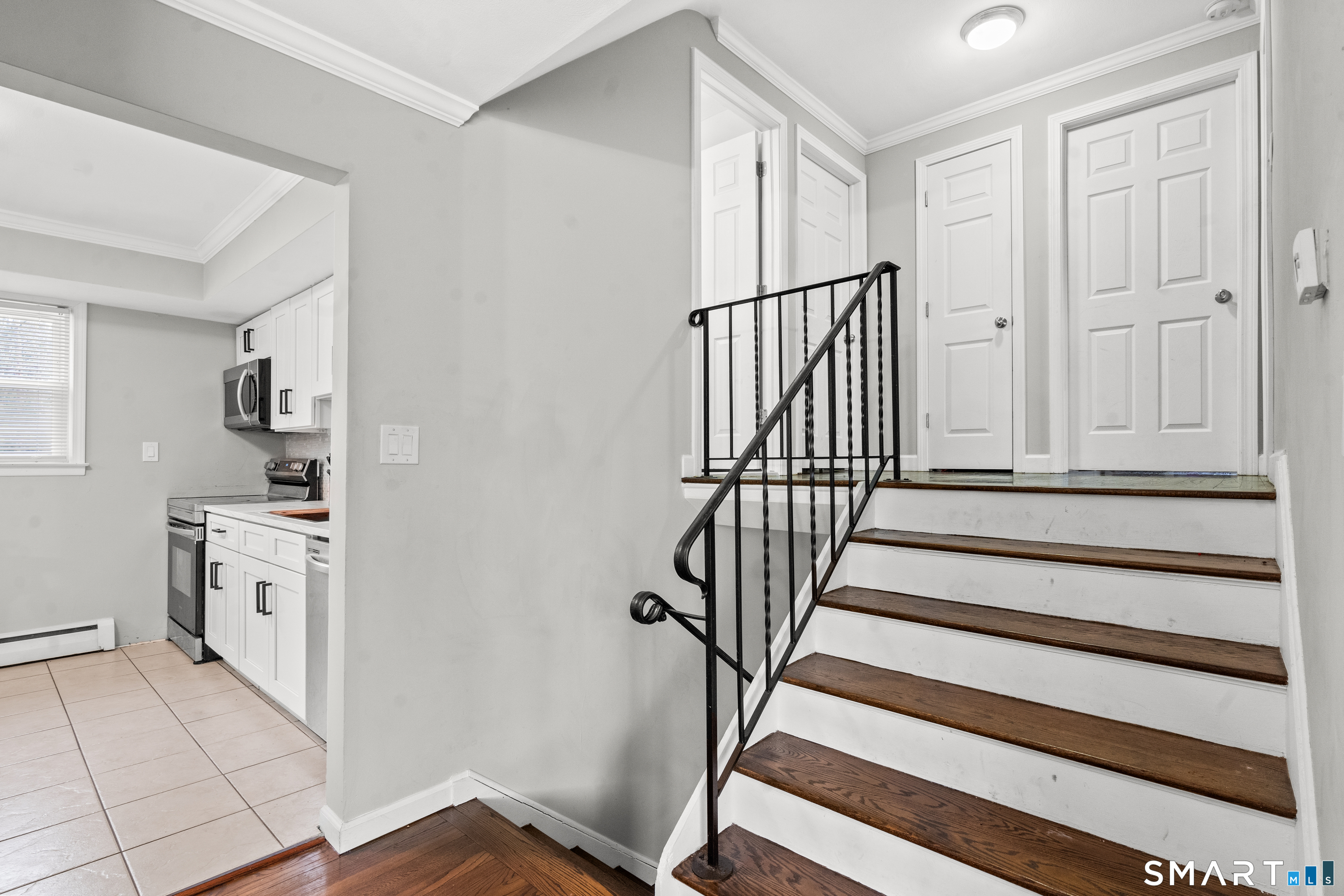 41 Pine Tree Ridge Meriden, CT 06450 - Photo 8 of 16 Split level showing stairs up to 3 bedrooms and full bathroom