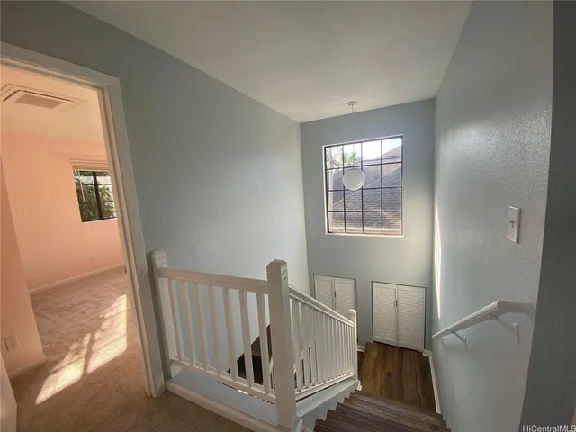 a view of a hallway with windows