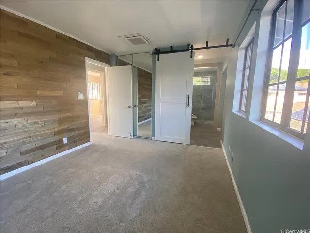 en empty room with windows and outdoor view