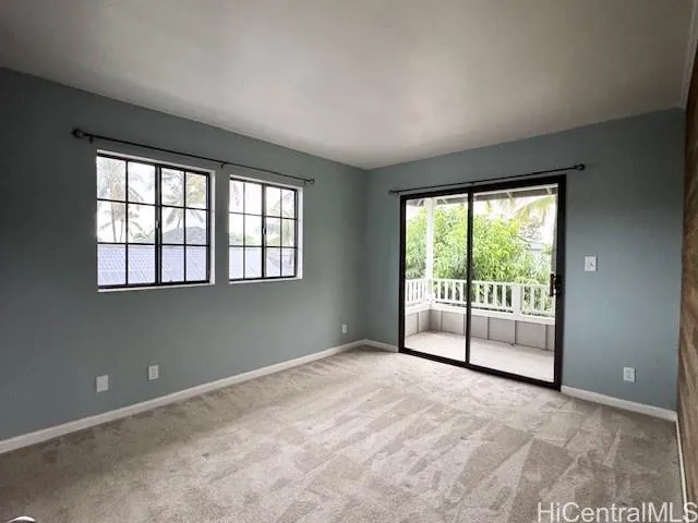 a view of an empty room with a balcony