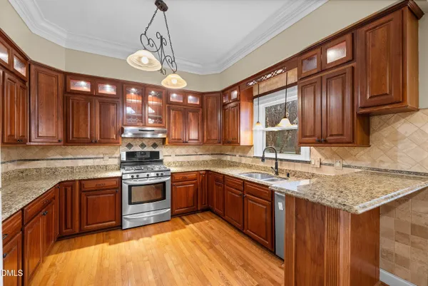 a kitchen with sink and cabinets