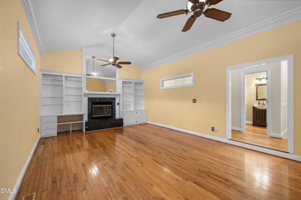 a view of a room with wooden floor