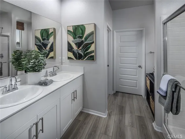 a bathroom with a sink a mirror a vanity and window