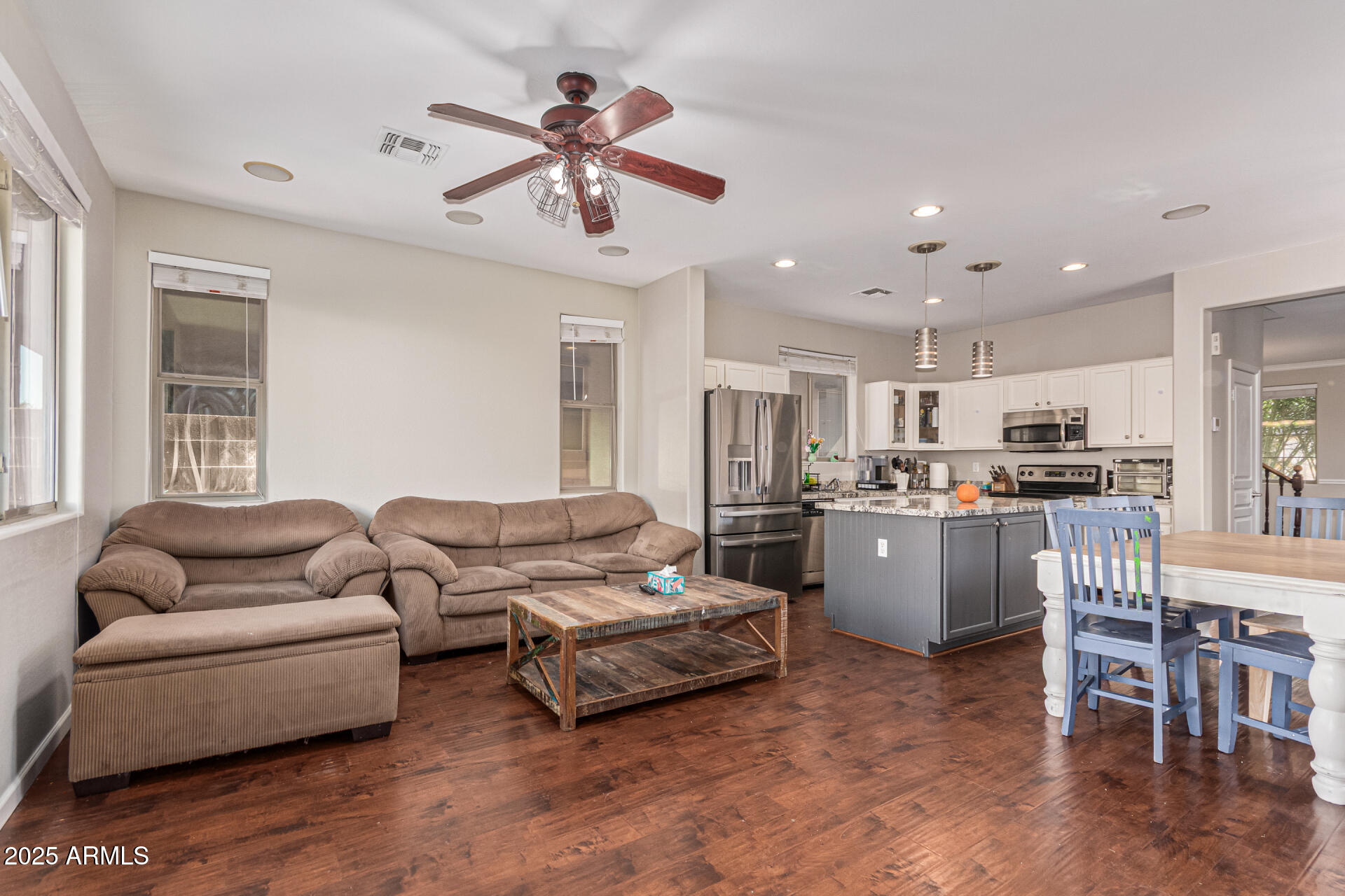 3802 East Chickadee Road Gilbert, AZ 85297 - Photo 7 of 29 a living room with furniture kitchen area and a window