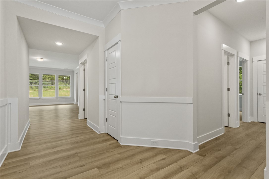 315 Old Shirley Road Central, SC 29630 - Photo 4 of 26 This spacious interior hall boasts elegant flooring and ample natural light from surrounding windows.
