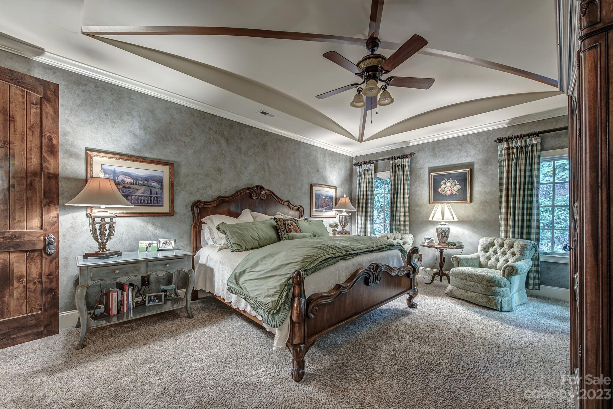 505 Stuart Ridge Cramerton, NC 28032 - Photo 14 of 33 a spacious bedroom with a bed and a chandelier