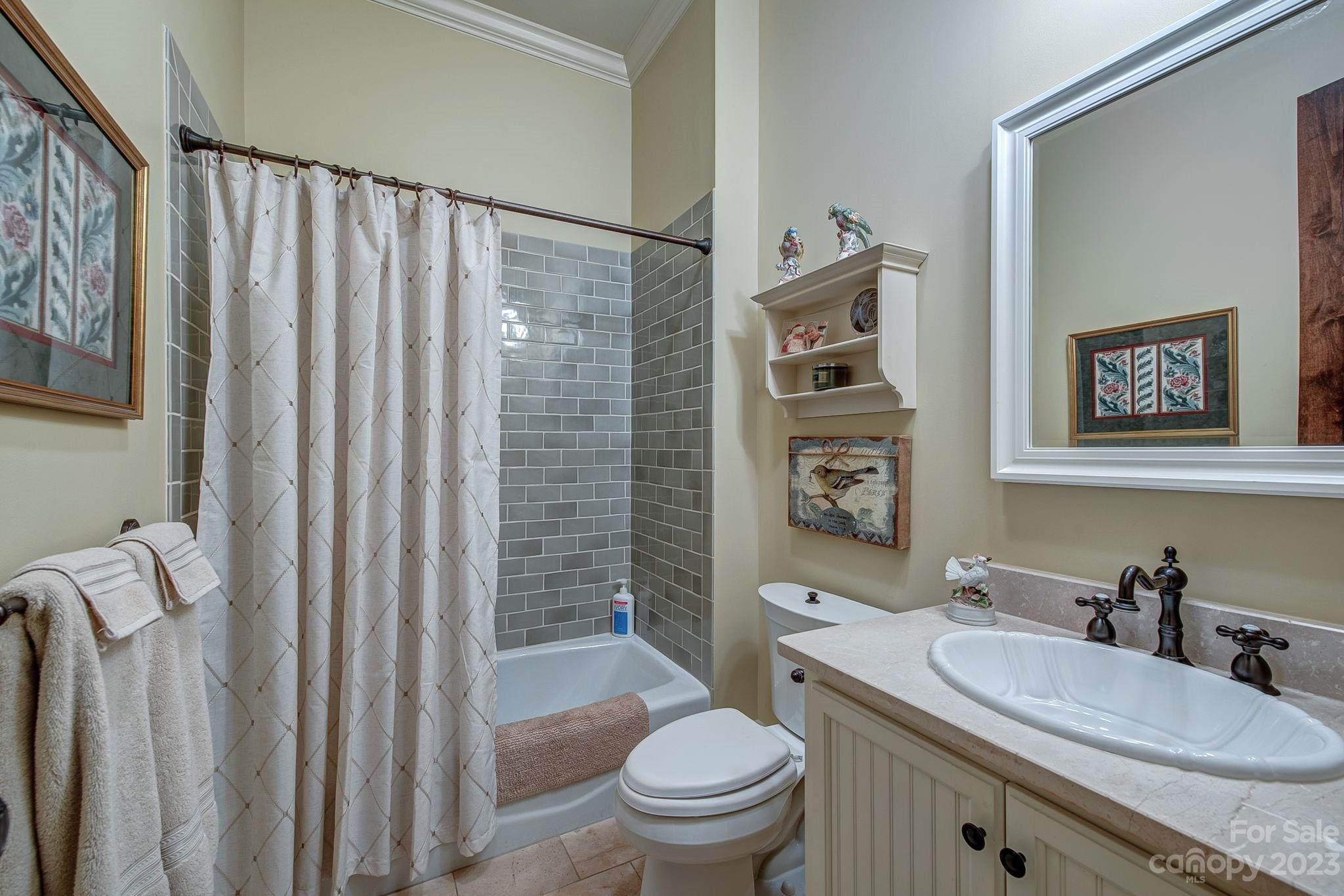 505 Stuart Ridge Cramerton, NC 28032 - Photo 18 of 33 a bathroom with a granite countertop sink toilet and shower