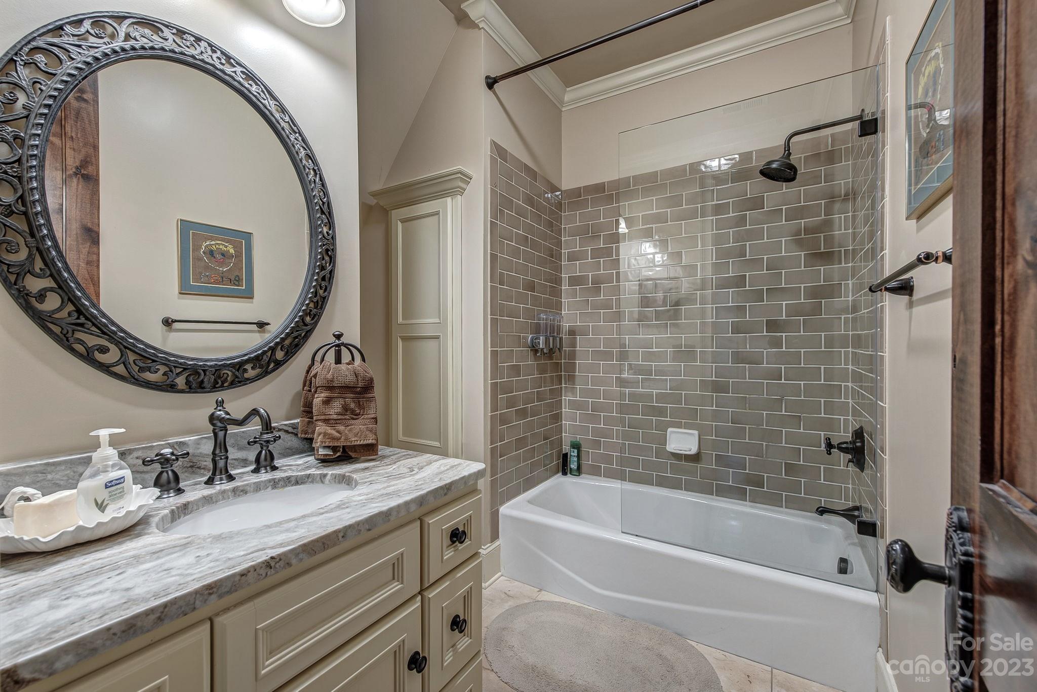 505 Stuart Ridge Cramerton, NC 28032 - Photo 23 of 33 a bathroom with a granite countertop sink mirror toilet and bathtub