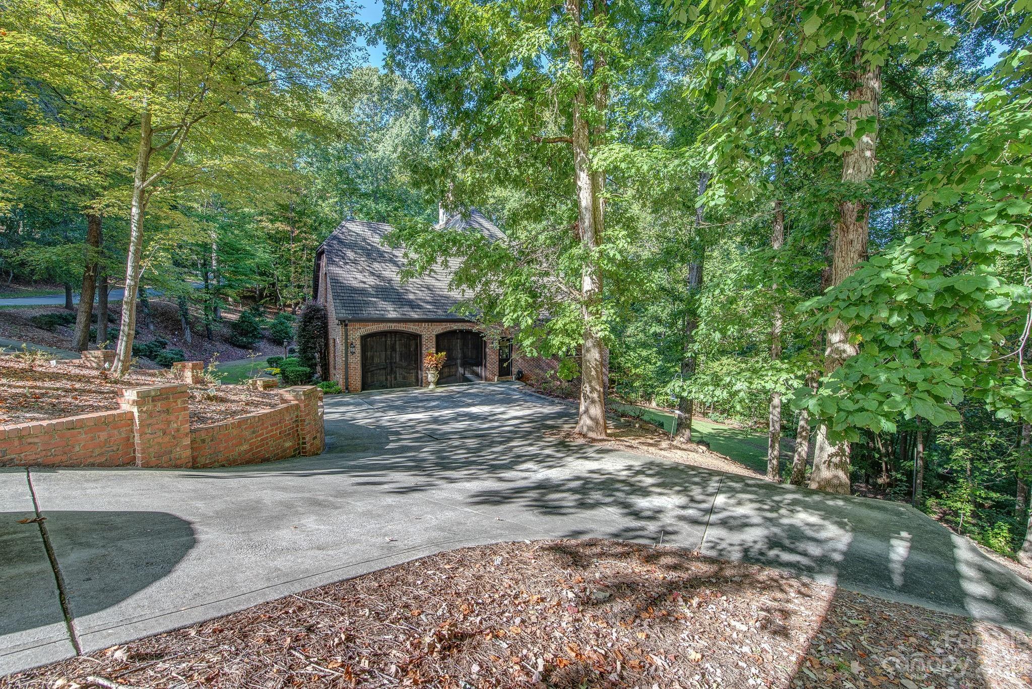 505 Stuart Ridge Cramerton, NC 28032 - Photo 4 of 33 a front view of a house with garden