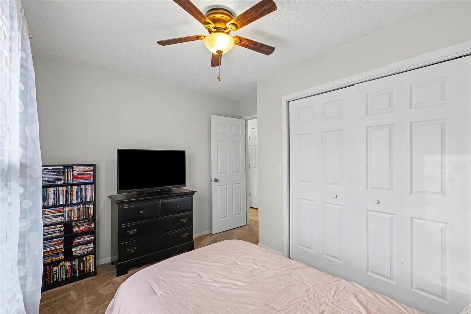 515 Valley View Drive Philo, IL 61864 - Photo 17 of 25 a bedroom with a bed and a flat screen tv