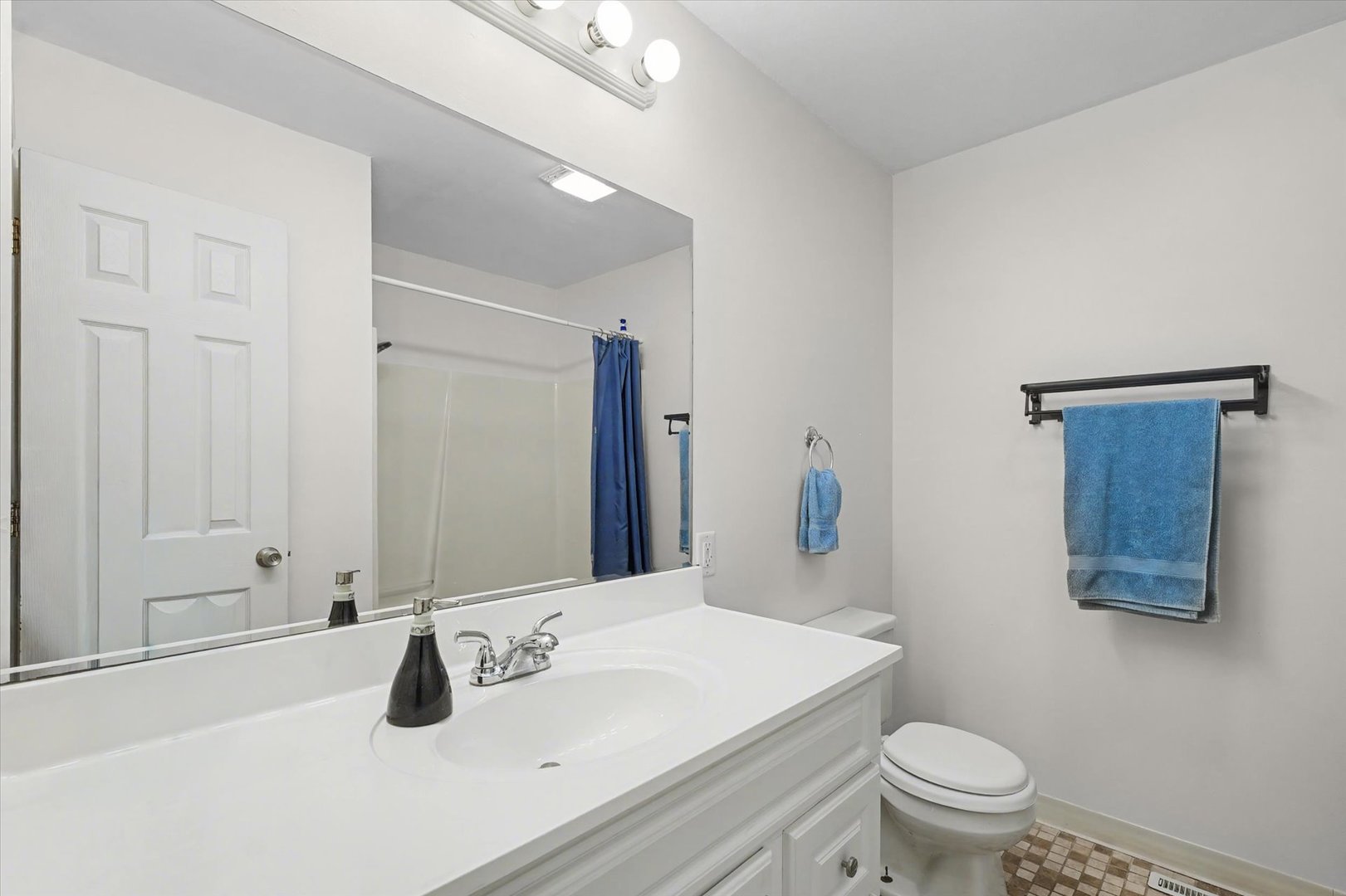 515 Valley View Drive Philo, IL 61864 - Photo 20 of 25 a bathroom with a sink toilet and vanity