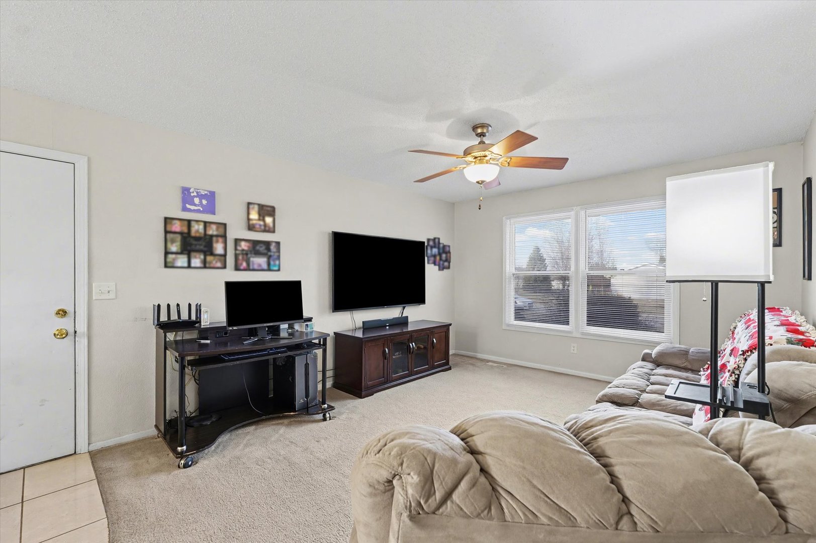 515 Valley View Drive Philo, IL 61864 - Photo 5 of 25 a bedroom with a bed and a flat screen tv