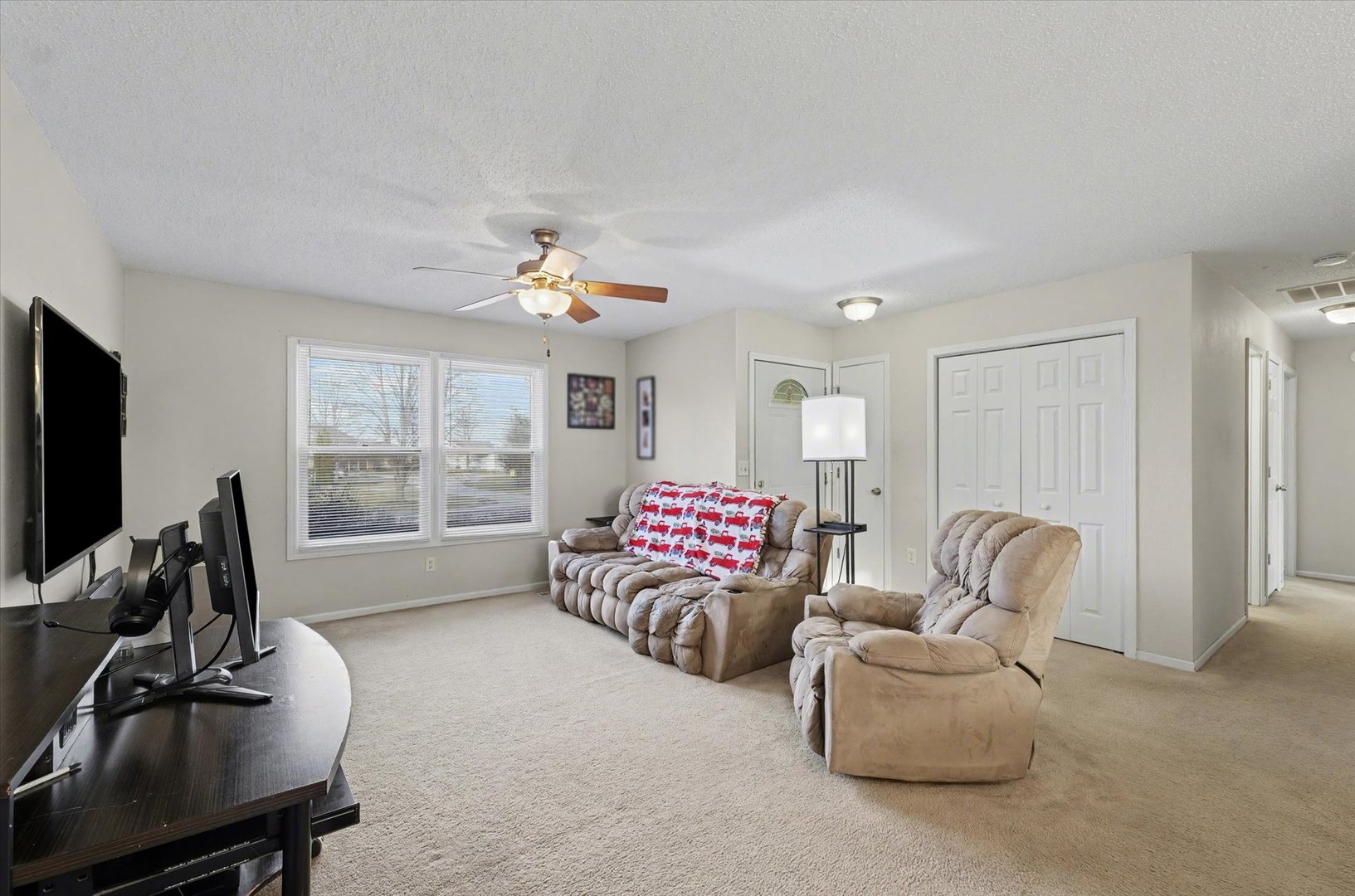 515 Valley View Drive Philo, IL 61864 - Photo 6 of 25 a living room with furniture and a flat screen tv