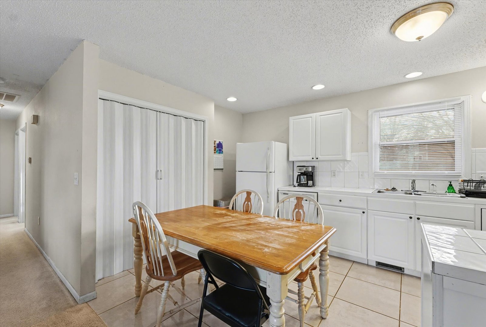 515 Valley View Drive Philo, IL 61864 - Photo 8 of 25 a kitchen with stainless steel appliances granite countertop a stove a sink dishwasher and a refrigerator with wooden floor
