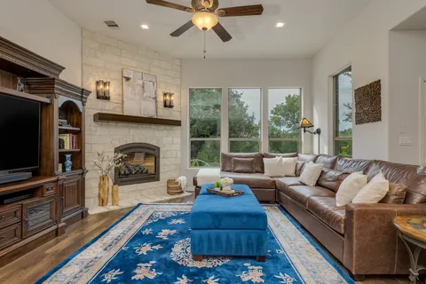 a living room with furniture and a fireplace