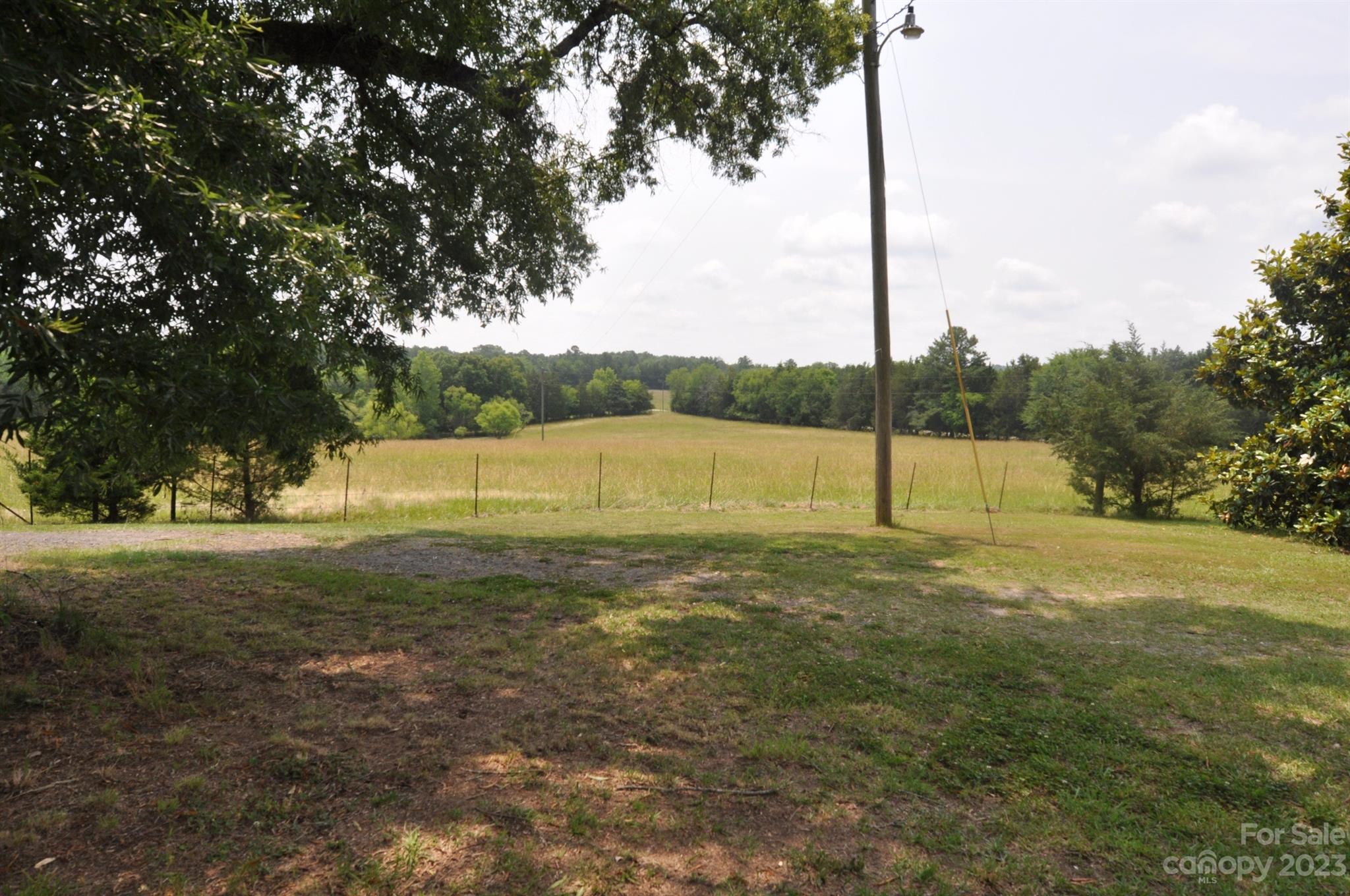 2546 Trussel Road Chester, SC 29706 - Photo 17 of 25 a view of a field with trees in the background