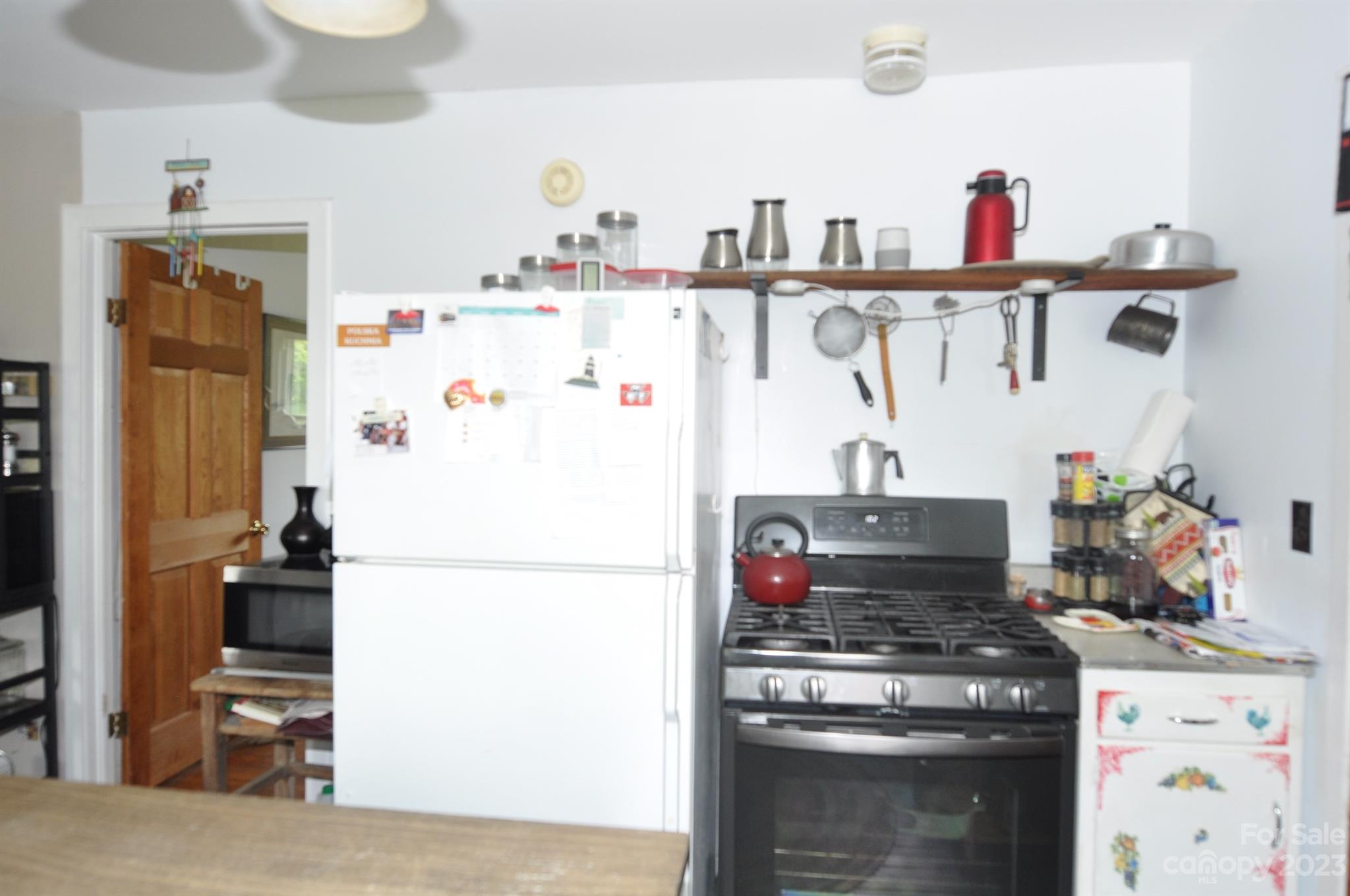 2546 Trussel Road Chester, SC 29706 - Photo 9 of 25 a kitchen with a refrigerator and a stove