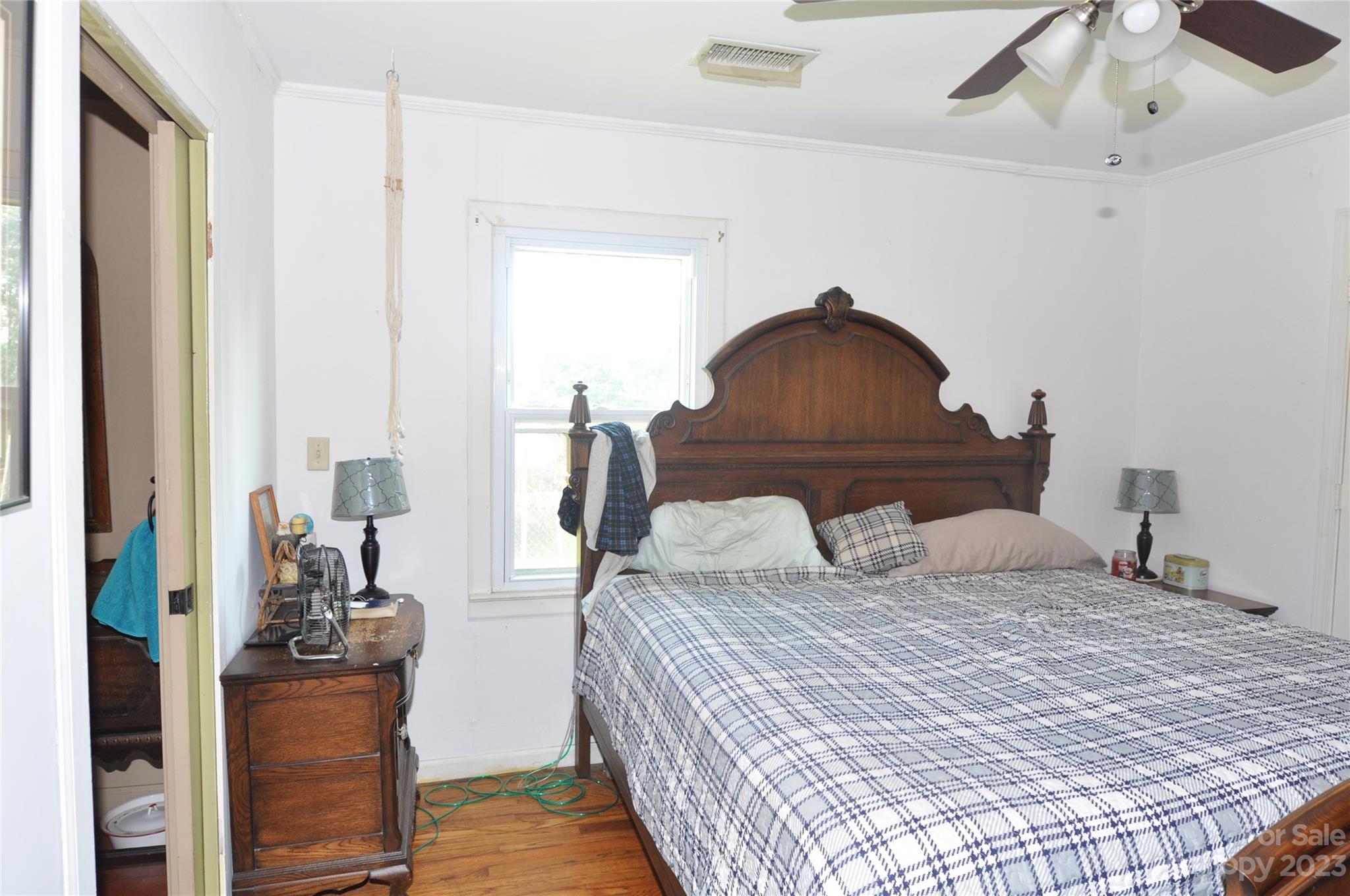 2546 Trussel Road Chester, SC 29706 - Photo 10 of 25 a bedroom with a bed and wooden floor