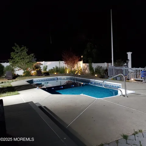 a view of a swimming pool with a patio