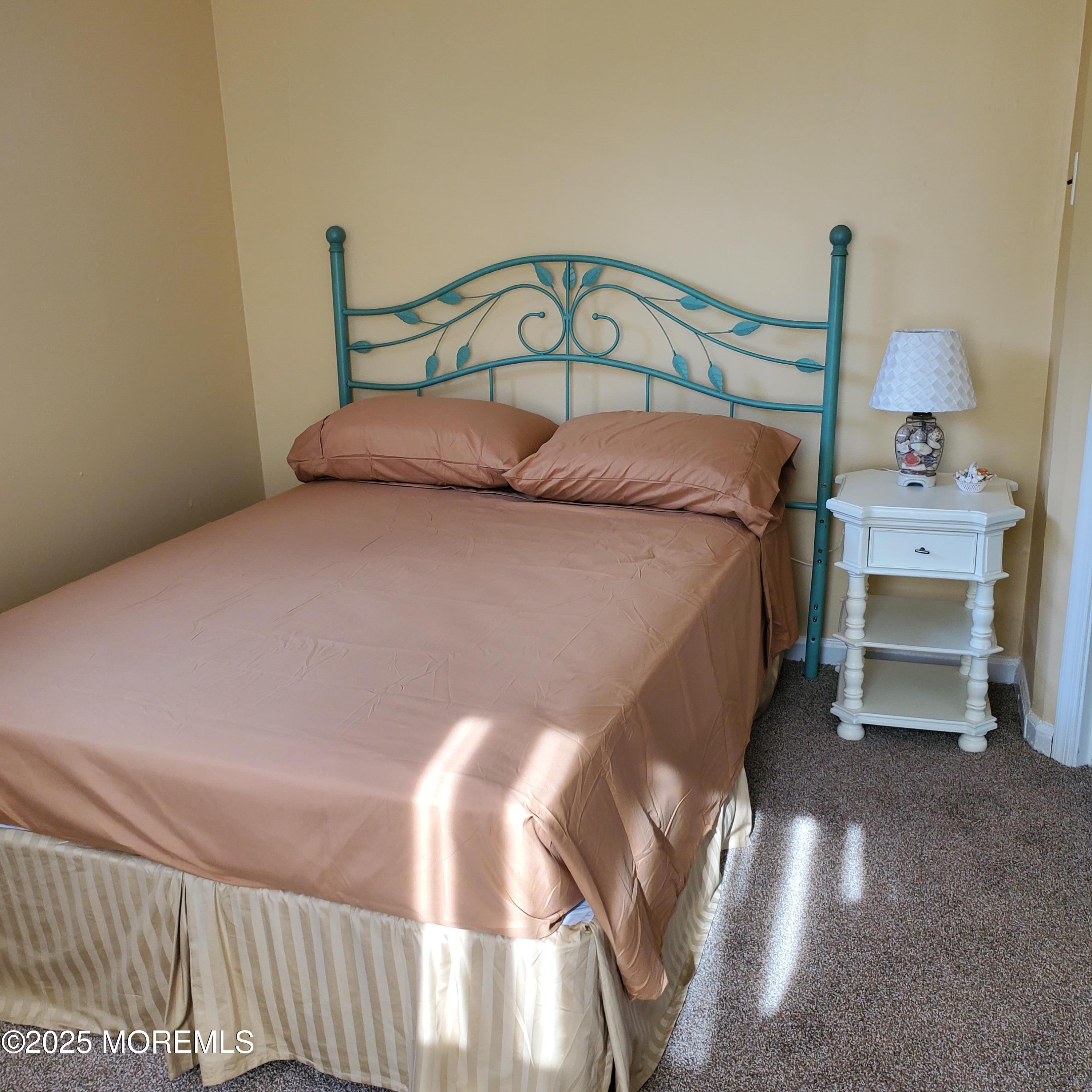 22 Queen Ann Road Brick, NJ 08723 - Photo 18 of 22 a bed sitting in a bedroom next to a window