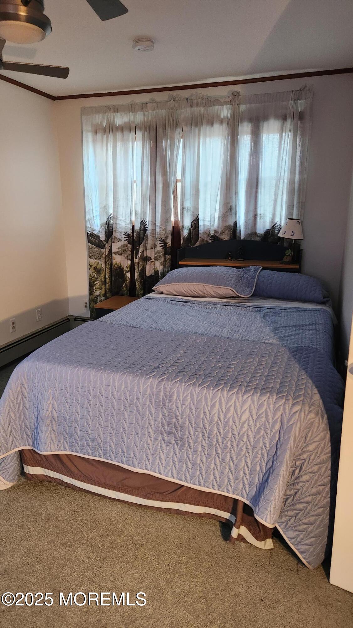22 Queen Ann Road Brick, NJ 08723 - Photo 20 of 22 a bed sitting in a spacious bedroom next to a window
