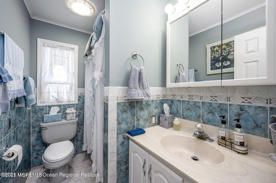 22 Queen Ann Road Brick, NJ 08723 - Photo 21 of 22 a bathroom with a sink toilet and mirror