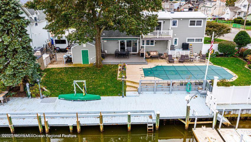 22 Queen Ann Road Brick, NJ 08723 - Photo 3 of 22 an aerial view of a house with swimming pool and outdoor seating