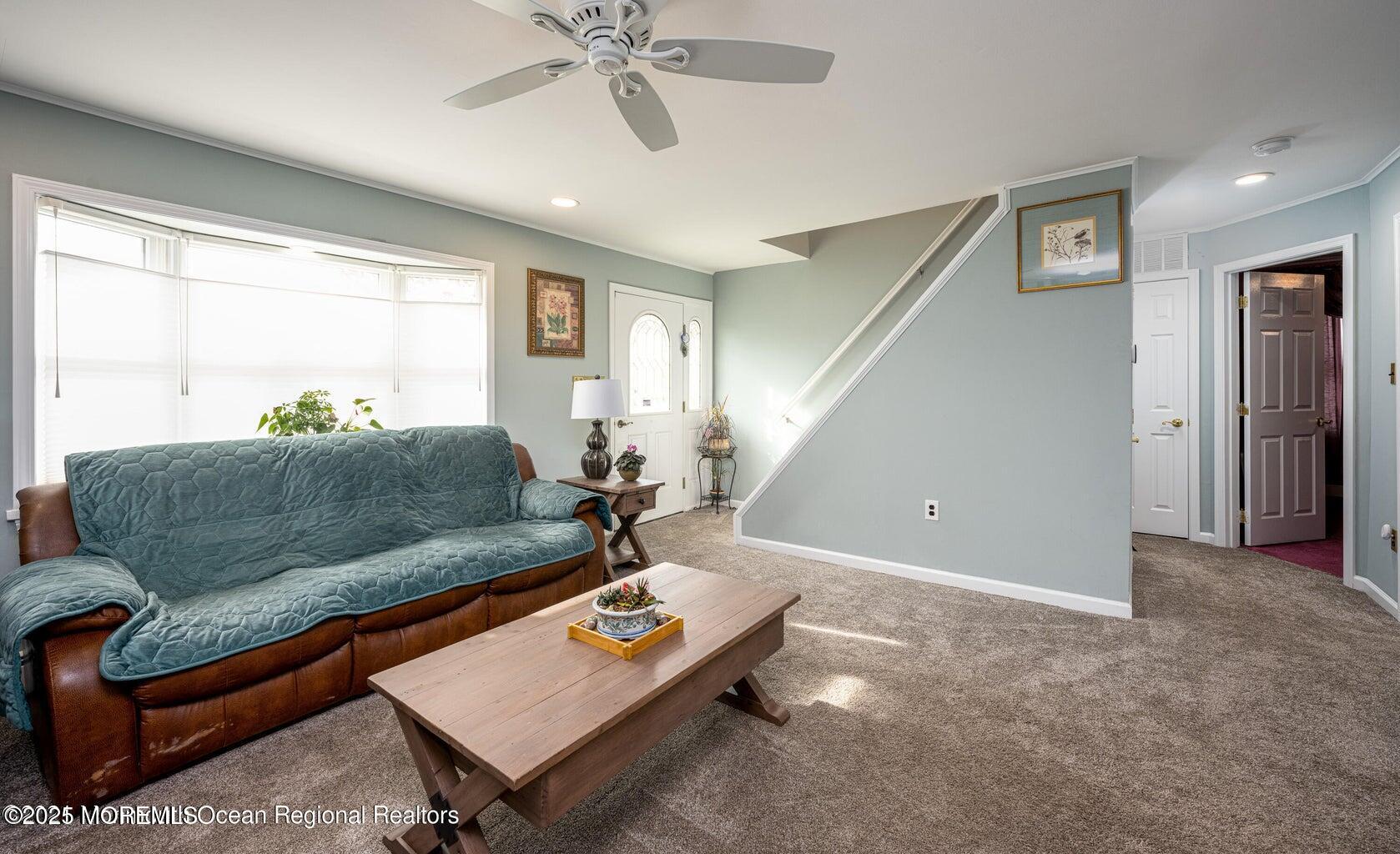 22 Queen Ann Road Brick, NJ 08723 - Photo 8 of 22 a living room with furniture and a window
