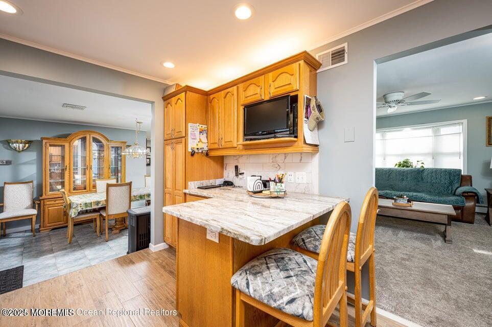 22 Queen Ann Road Brick, NJ 08723 - Photo 10 of 22 a living room with furniture and a flat screen tv