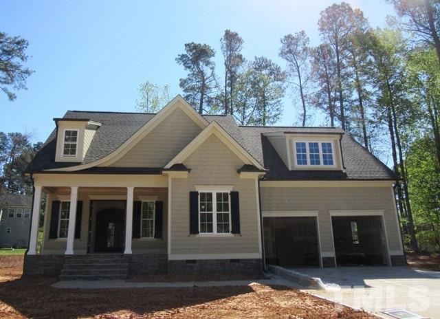 8620 Wapello Lane Raleigh, NC 27613 - Photo 1 of 25 a front view of a house with a yard
