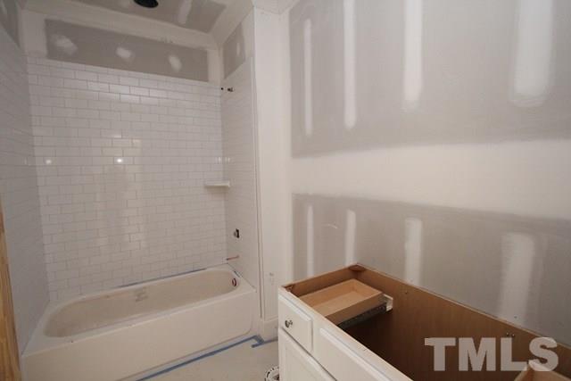 8620 Wapello Lane Raleigh, NC 27613 - Photo 14 of 25 a bathroom with a bathtub and shower