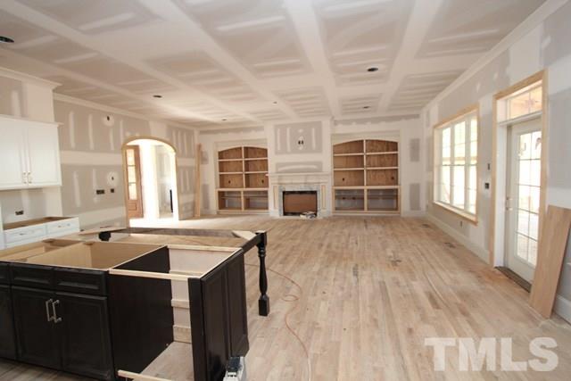 8620 Wapello Lane Raleigh, NC 27613 - Photo 3 of 25 a open kitchen with cabinets a sink and a stove