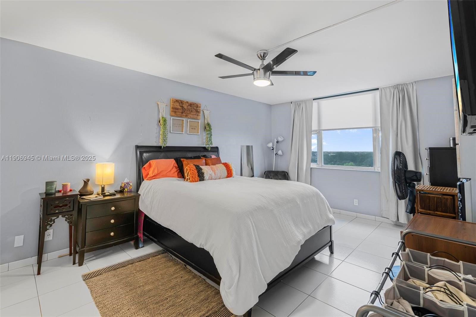 4400 Hillcrest Drive, Unit 912B Hollywood, FL 33021 - Photo 16 of 34 a bedroom with a bed and window