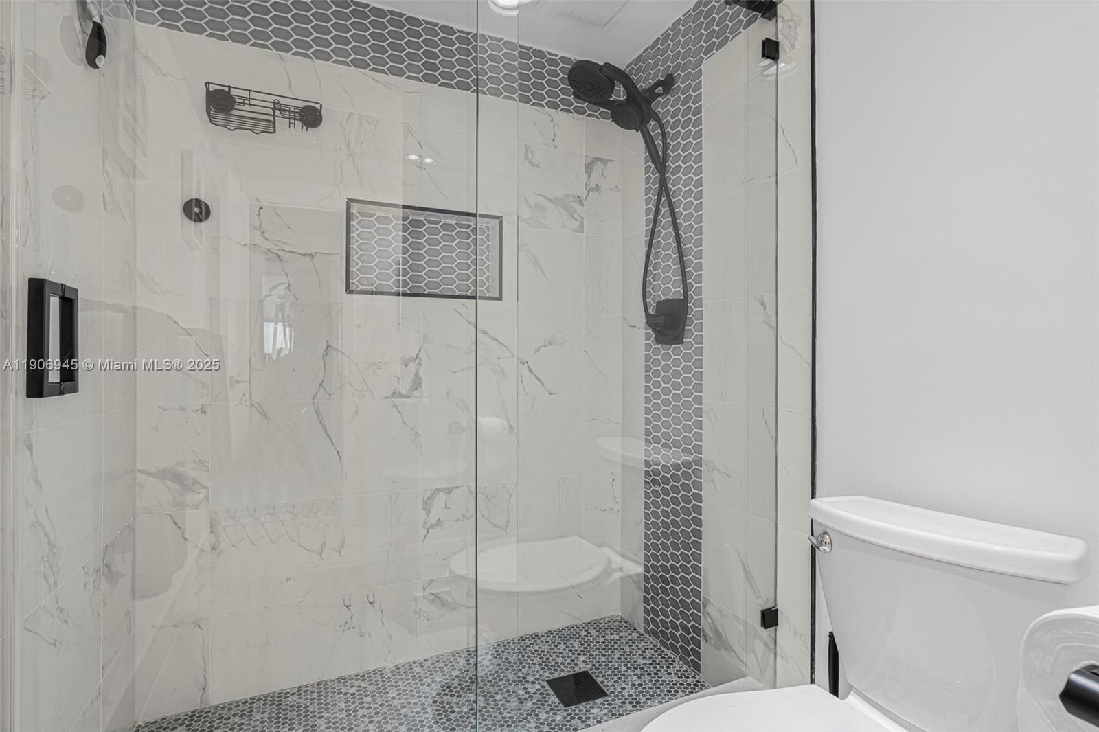 4400 Hillcrest Drive, Unit 912B Hollywood, FL 33021 - Photo 23 of 34 a bathroom with a shower and toilet