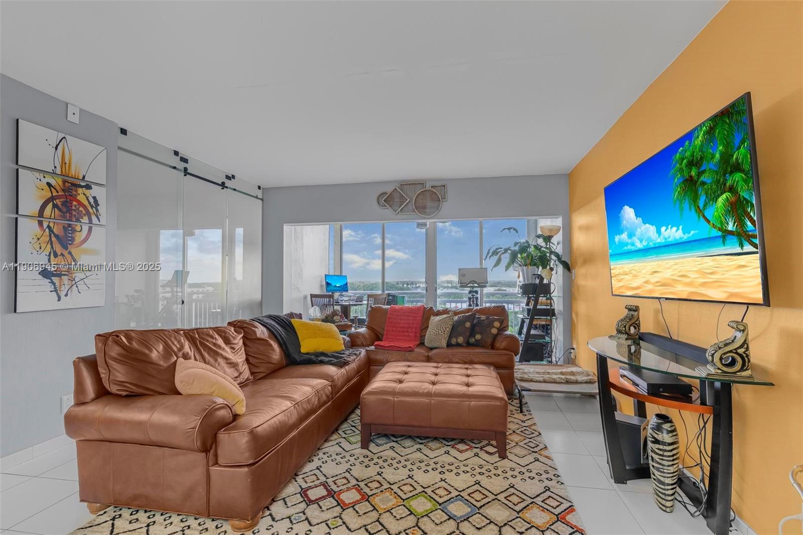 4400 Hillcrest Drive, Unit 912B Hollywood, FL 33021 - Photo 9 of 34 a living room with furniture and a flat screen tv