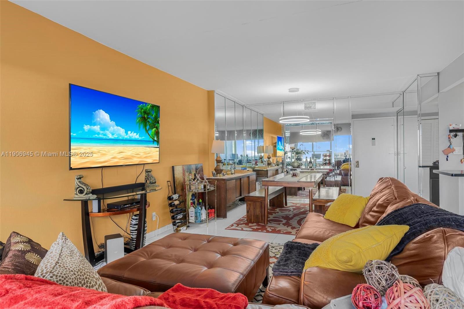 4400 Hillcrest Drive, Unit 912B Hollywood, FL 33021 - Photo 10 of 34 a living room with furniture a window and a flat screen tv
