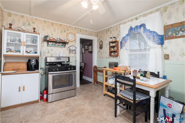 a kitchen with stainless steel appliances kitchen island granite countertop a sink and cabinets